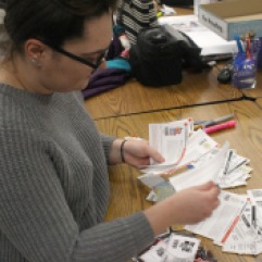 Ciara Diana, a Graphic Design student sorts through a stack of coupons during her free time from class. PHOTO BY HALEY SEDGWICK