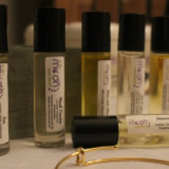A selection of essential oil rollerballs sold by To the Moon and Back, Miranda Veide's health and wellness line.